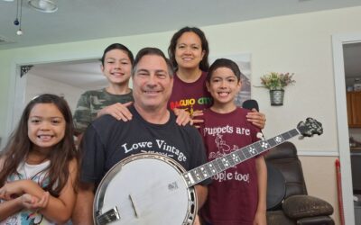 Steven Ware wins Strings for Dreams Bluegrass Raffle