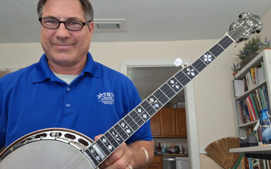 Steven Ware wins Deering Banjo in Strings for Dreams raffle