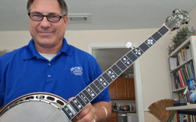 Steven Ware wins Deering Banjo in Strings for Dreams raffle